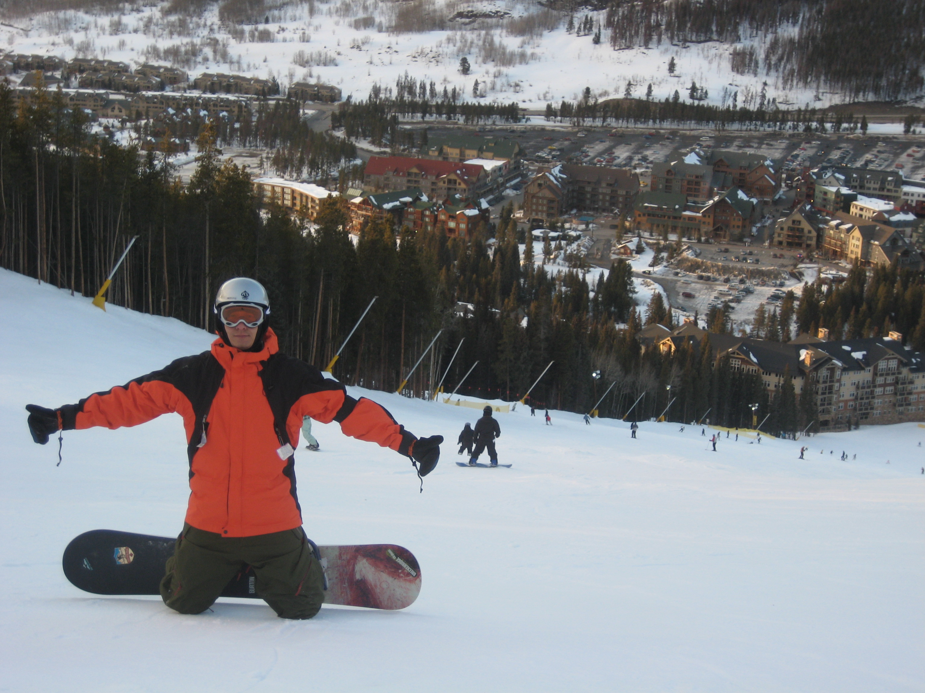 Snowboarding above a mountain resort